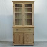 An early 20th century pitch pine cabinet