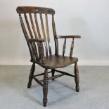 A Victorian elm seated splat back armcha