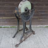 A Victorian grinding wheel, on a cast ir