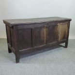 An 18th century oak panelled coffer, 147