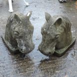 A pair of reconstituted stone horses hea