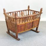 A carved hardwood cradle, 101cm