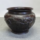 A Japanese bronze jardiniere, relief dec