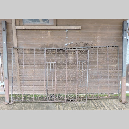 A pair of black wrought iron garden gate