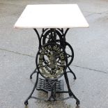 A Victorian Singer cast iron table, with