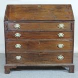 A George III mahogany bureau, on bracket