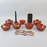 A set of six oriental lacquered tea bowl