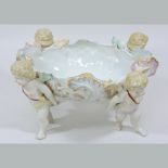 A continental style porcelain cherub bow