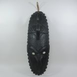 An Indonesian tribal mask, in the style