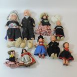 A collection of various dolls, to includ