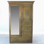 An Edwardian walnut combination wardrobe