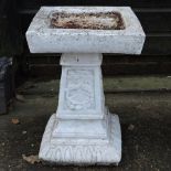 A white painted stone bird bath, 53cm ta