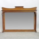 An Arts and Crafts oak framed overmantle