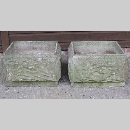 A pair of reconstituted stone garden pla