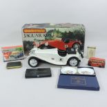 A model of a Jaguar 100SS, boxed, togeth