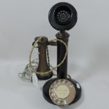 A 1920's bakelite stick telephone, 32cm