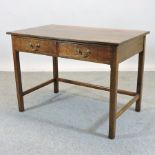 An early 20th century oak writing table,