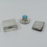 A silver inkwell, with a blue enamelled