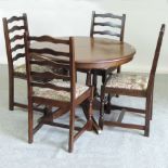 An Old Charm style oak circular dining t