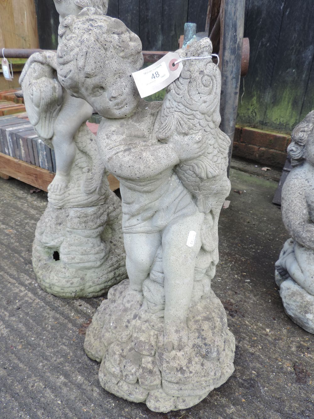 A reconstituted stone figural garden fou - Image 2 of 8