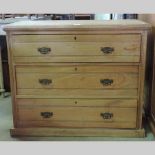 An Edwardian satin walnut chest, on a pl