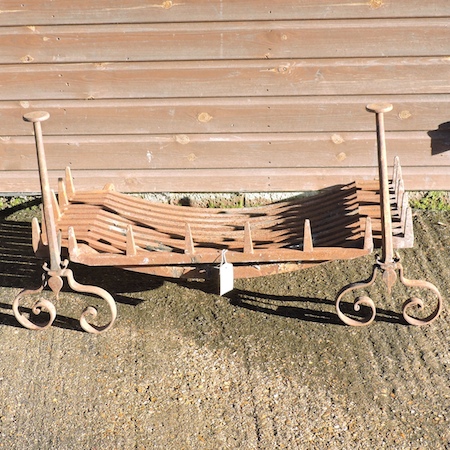 A cast iron fire grate, with andirons, 9