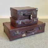A mid 20th century leather suitcase, 72c