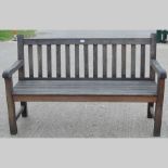 A modern hardwood garden bench, 150cm