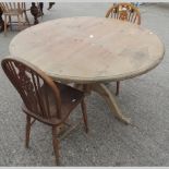 A modern pine circular table, 121cm diam