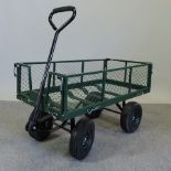 A green painted metal garden cart, 102cm