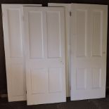 A collection of four white painted doors