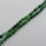 A jade coloured bead necklace