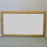 A large pine framed wall mirror, 94 x 16