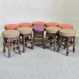 A collection of ten bar stools, with pad