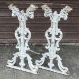 A pair of white painted ornate cast iron