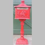 A modern red painted cast iron free stan