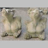 A pair of reconstituted stone gargoyles,