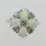 An 18 carat white gold, opal and diamond