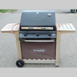 An outdoor Trekker gas barbecue, 139cm