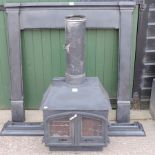 A cast iron wood burner, together a cast