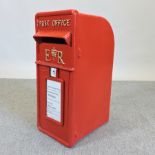 A reproduction postbox, 60cm tall