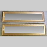 A pair of gilt framed wall mirrors, 142