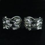 A pair of 18 carat white gold and diamon