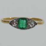 An Art Deco emerald and diamond three st