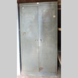 A grey metal two door cabinet, 92cm