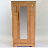 An Edwardian walnut single wardrobe, wit