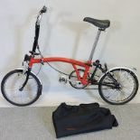 A Brompton three speed folding bicycle,