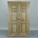 An antique pine cabinet, fitted with she
