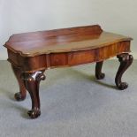 A William IV carved mahogany serpentine