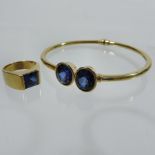 A 14 carat gold and sapphire set two sto